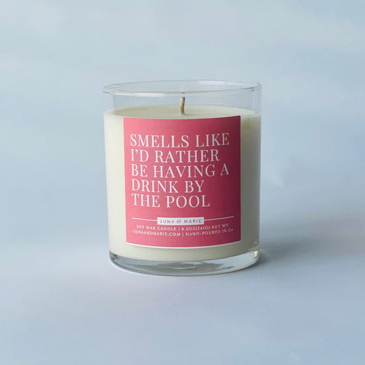 Candle with a pink label on a white background