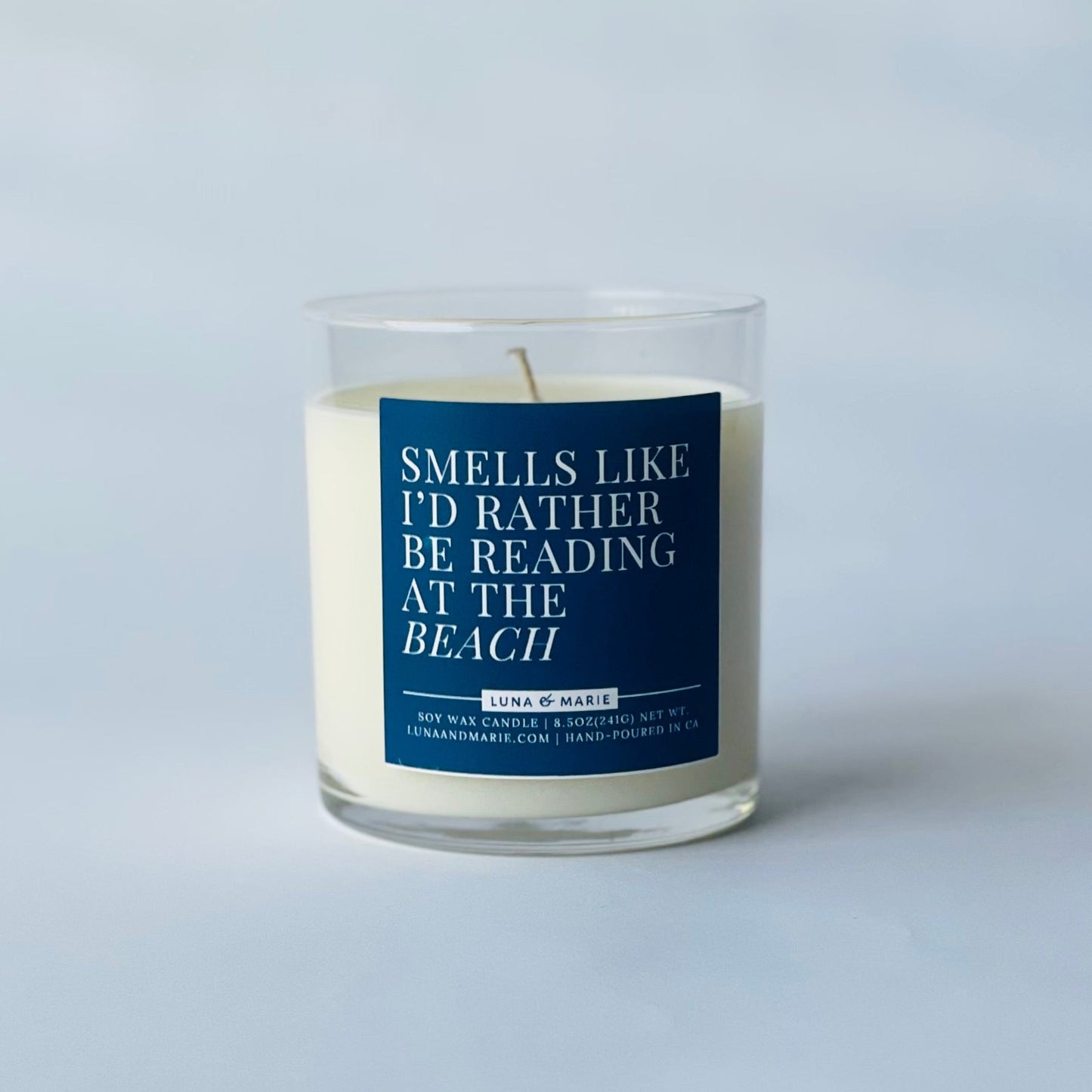 Candle with a blue label on a white background