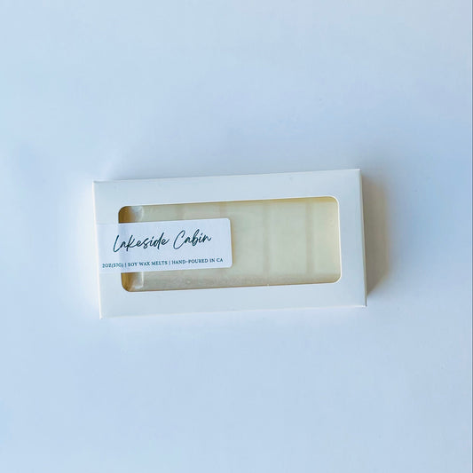 Bar of soap in a white box with 'Lakeside Cabin' label on a light gray background